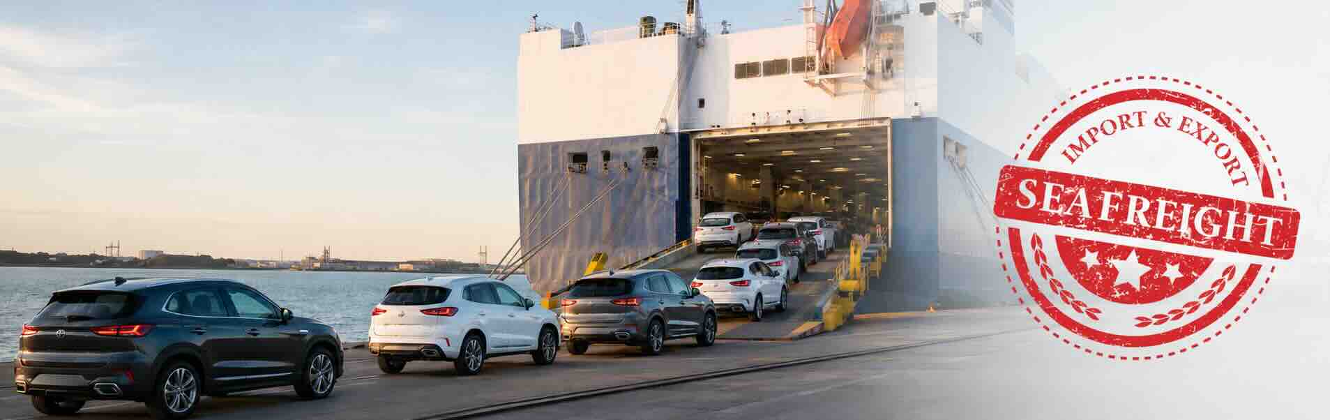 Vehicle shipping companies loading cars onto a sea freight vessel for international export.